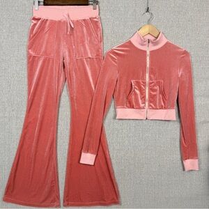 velour tracksuit with a zip-up top and bell-bottom pants.